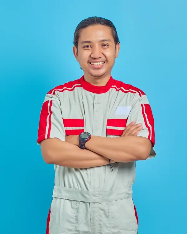 Portrait of Mike Larkin in a work uniform, arms crossed